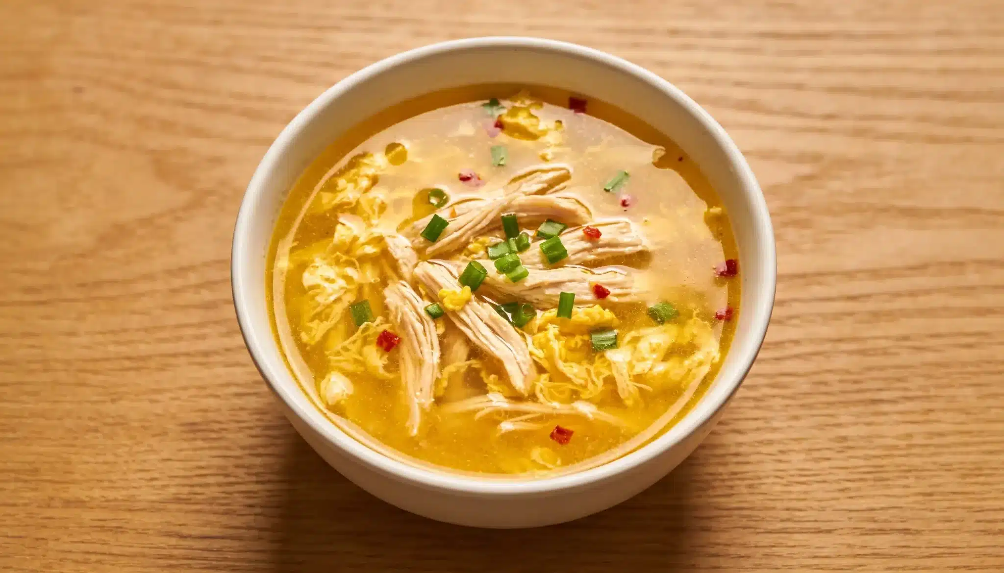 freepik closeup overhead bowl of hot and sour soup goldeny 74852