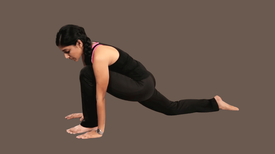 a woman doing ashwa sanchalanasana as a part of the surya namaskar series