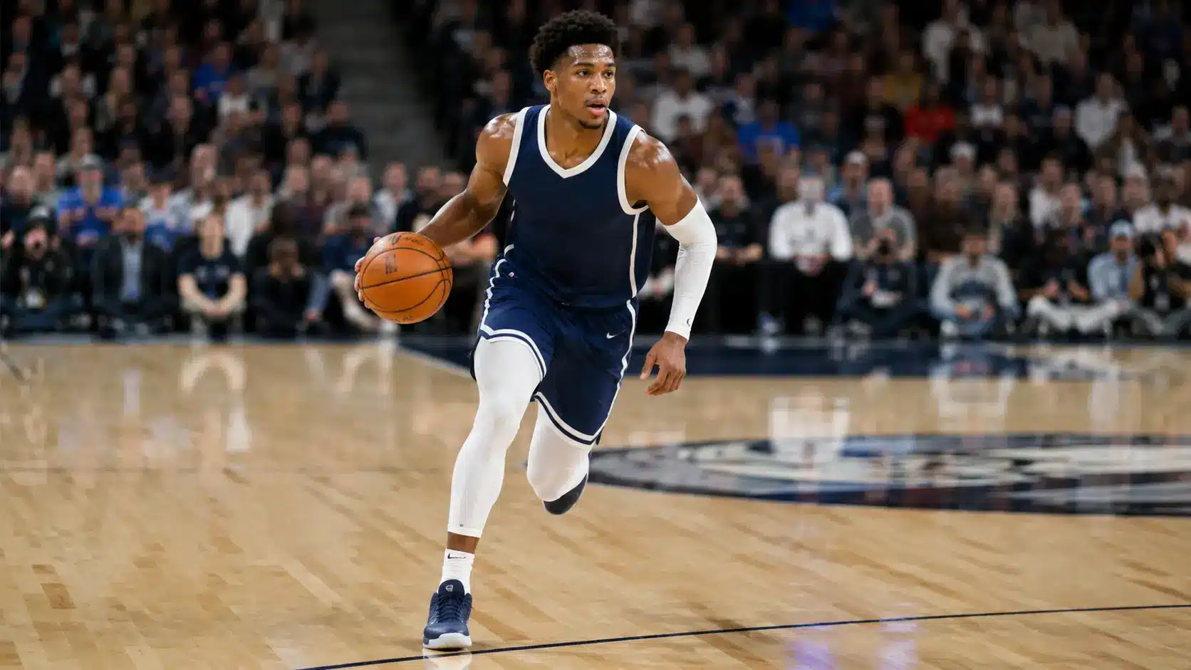 basketball player dribbling while running down the court