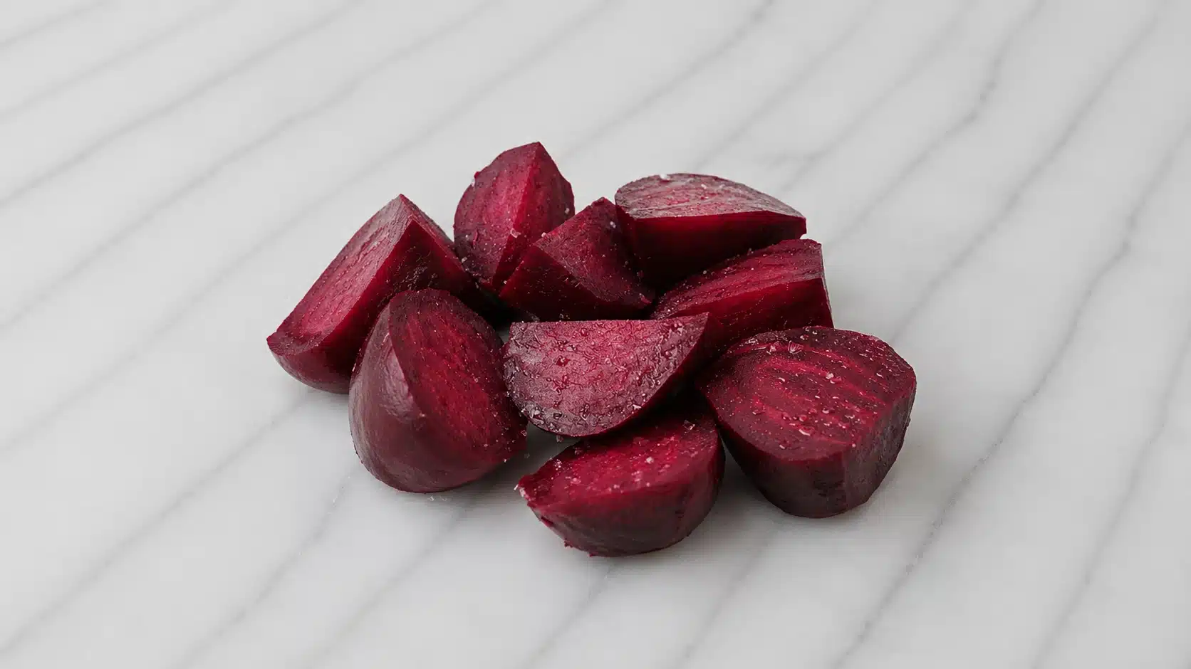 chopped beets on marble surface with soft natural lighting and rich color