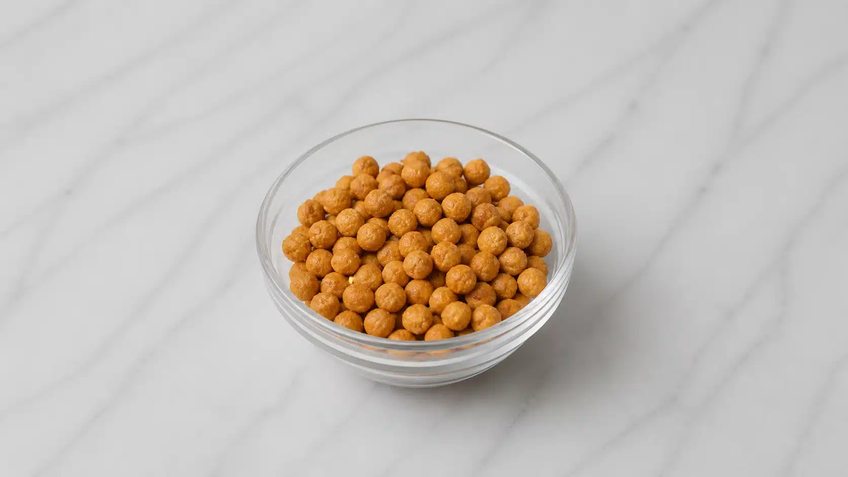 roasted chickpeas in a bowl on marble surface with soft light