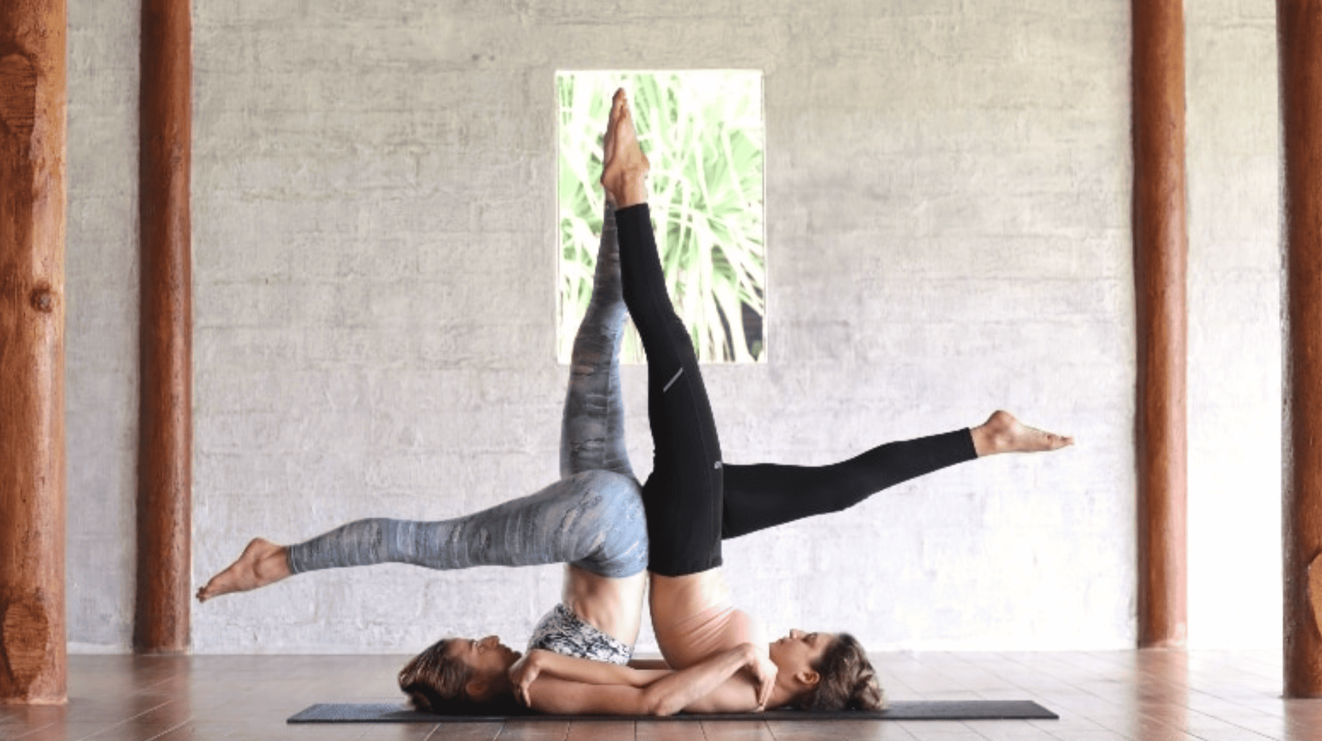 partner shoulder stand supported