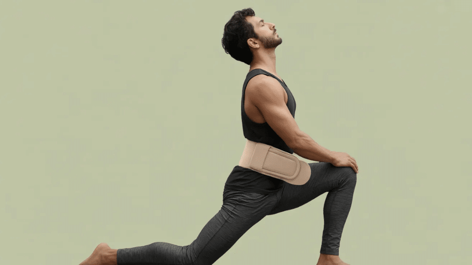 a man suffering from disc issues doing exercise to help his issues with a support belt aound the waist as precaution