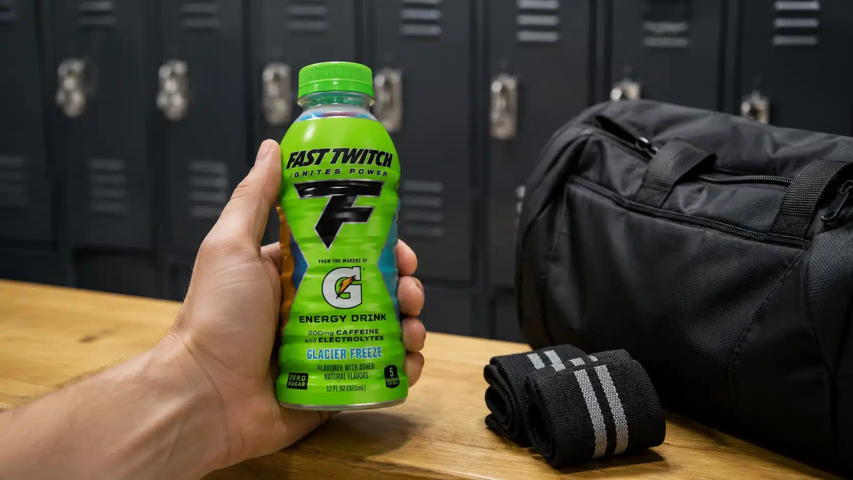 adult hand holding fast twitch near a locker room bench before a workout