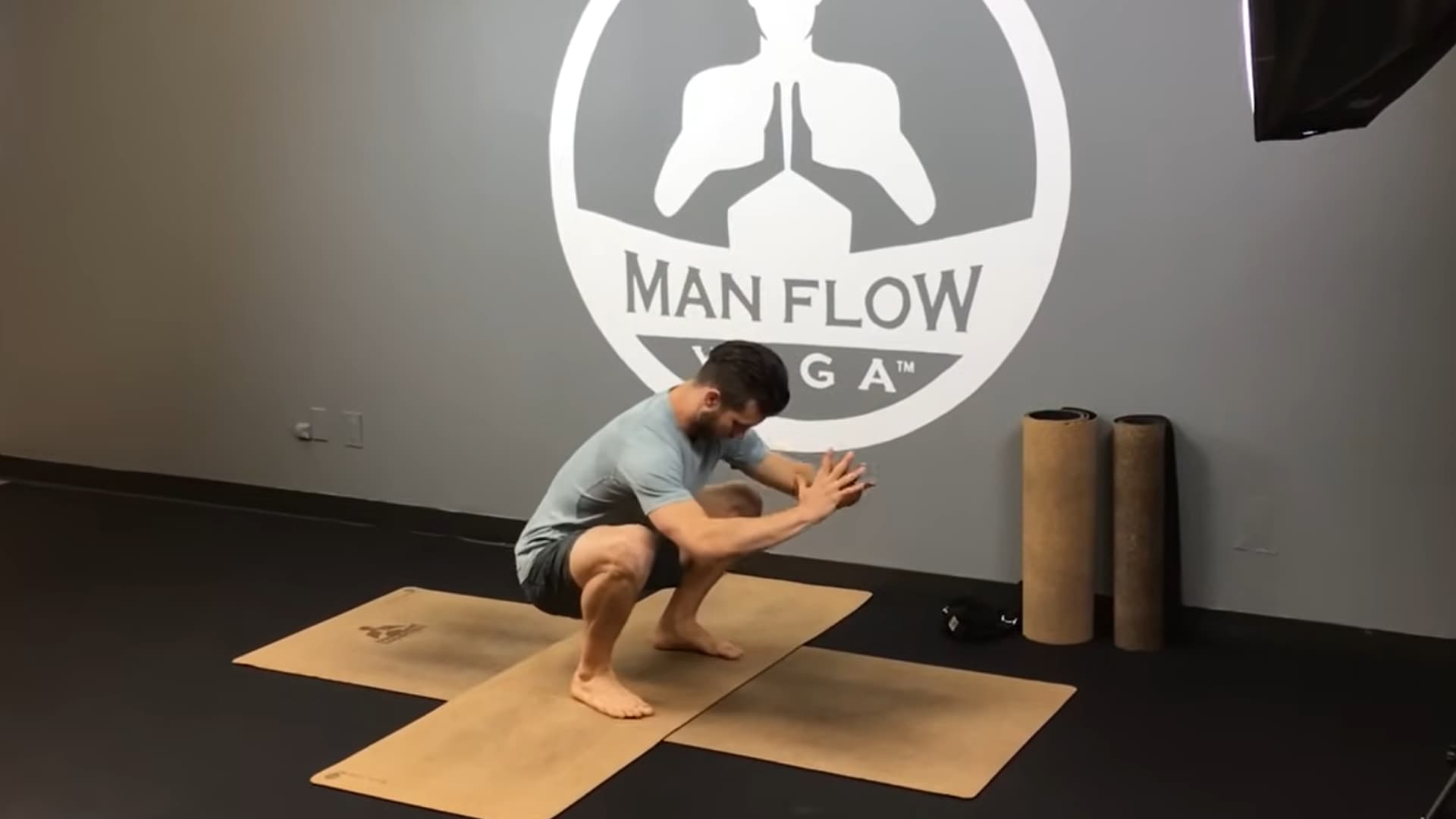 begin in a deep squat with knees close to armpits and chest lifted to prepare for balance