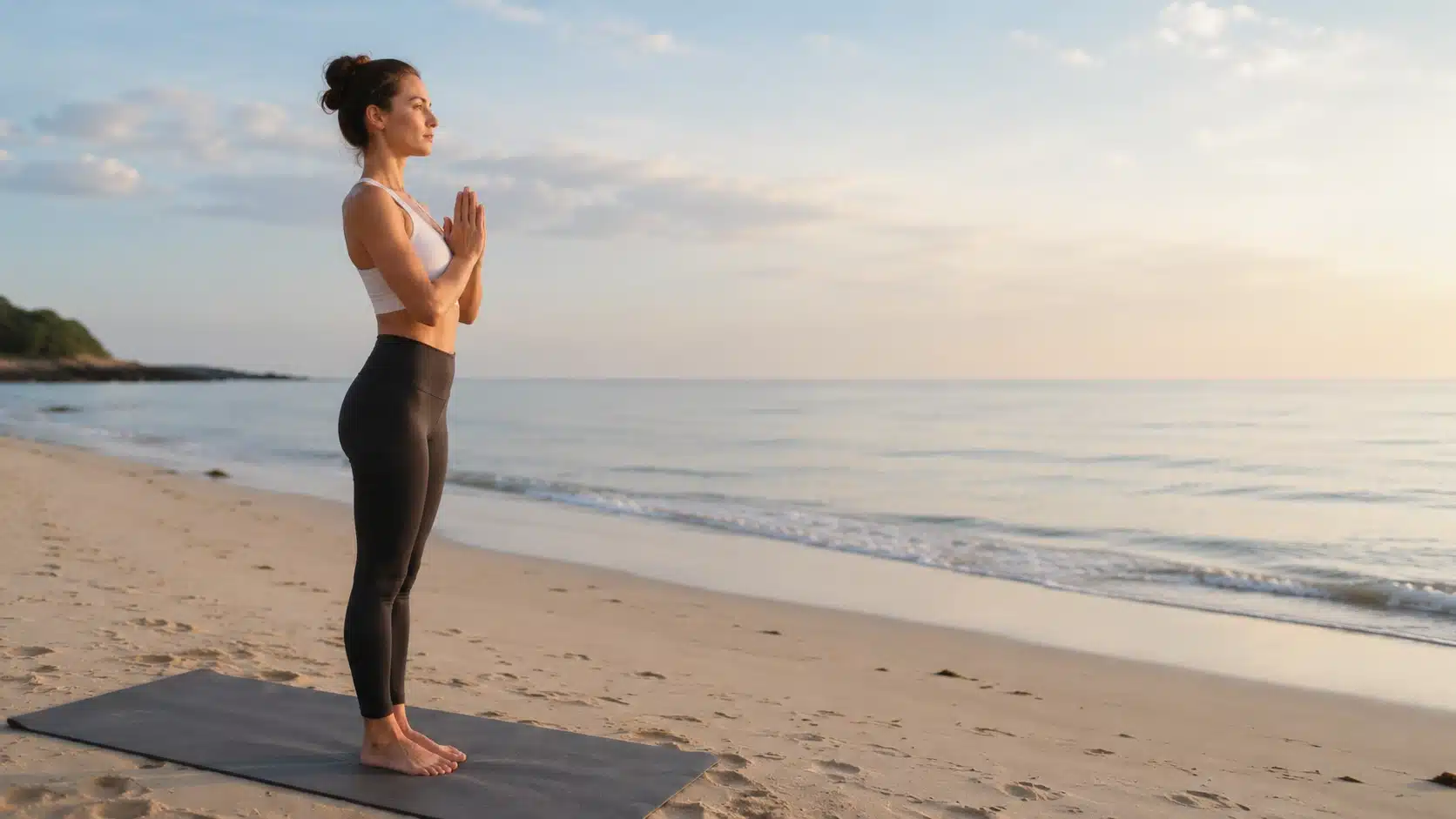 surya namaskar steps woman praying by beach