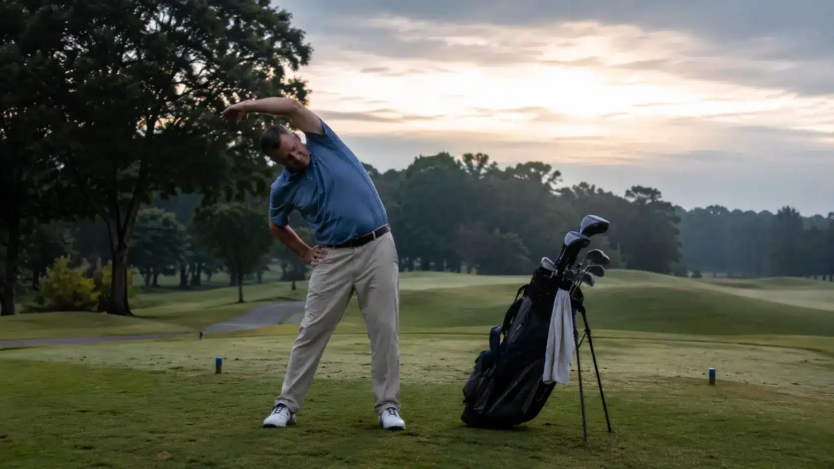 yoga for golfers stretch beside a golf bag for mobility and balance